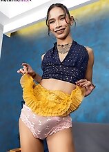 Dressed in a mini skirt and heels, ladyboy Linry shows off her slim body and her long cock, spreads her tight ass and plays with a toy