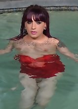 Kelly Clare stripping in the pool